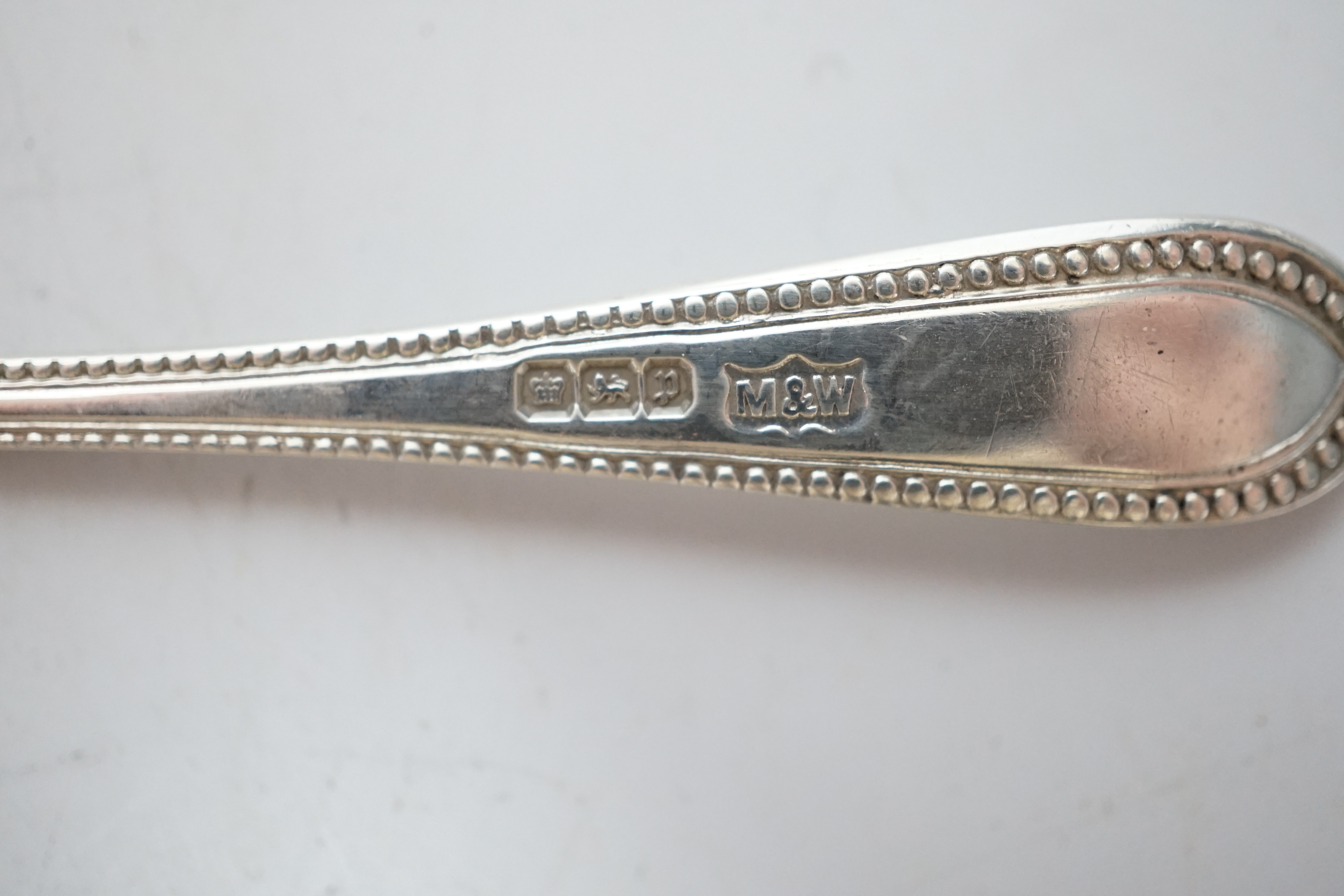 An Edwardian silver two handled bowl, Chester, 1902, diameter 10.4cm, a sterling bowl, a pair of engraved silver tub salts and matching salt spoons, Mappin & Webb, Sheffield, 1908 and a set of five silver teaspoons.
